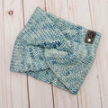 Hand knit Mecha merino wool twist headband in Thereza colorway featuring soft icy blue and pale aqua tonal variation