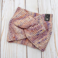 Hand knit Mecha merino wool twist headband in Zelda colorway featuring soft blush, lavender, cream, and peach tonal variation